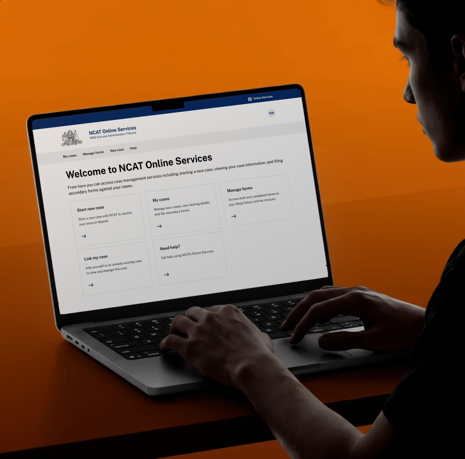 Person typing on a laptop against an orange wall, the screen showing the NCAT Online Services home page with cards to start a new case, view my cases and manage forms